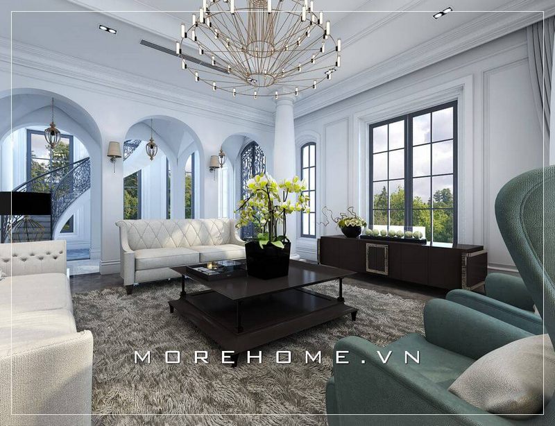 Bộ sofa tân cổ điển kiểu dáng văng tiện nghi cùng vỏ bọc vải màu trắng tinh tế là điểm nhấn ấn tượng của phòng khách biệt thự, nhà phố